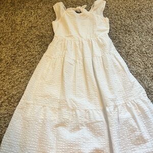 Size 10/12 Old navy White eyelit pattern dress. 3/4 length.Excellent condition!